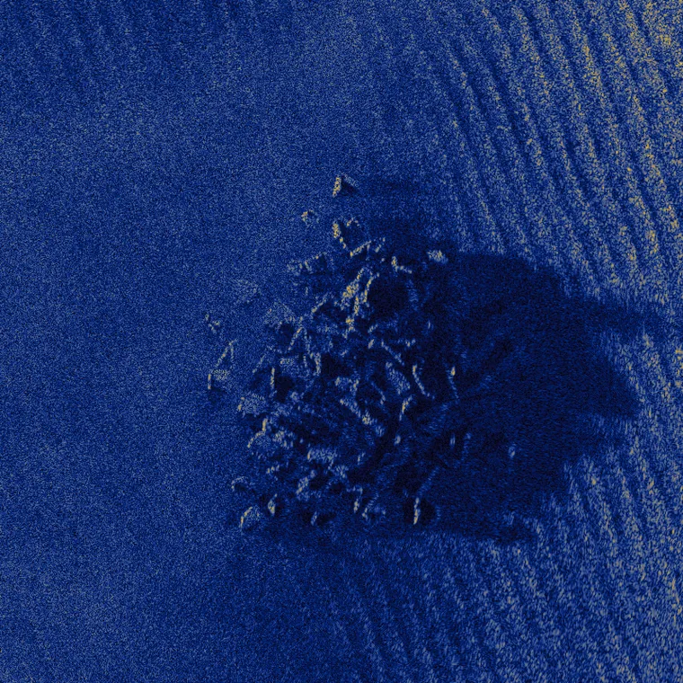 A rock outcrop and its acoustic shadow on rippled sand, simulated at 80,000 scatterers per square metre