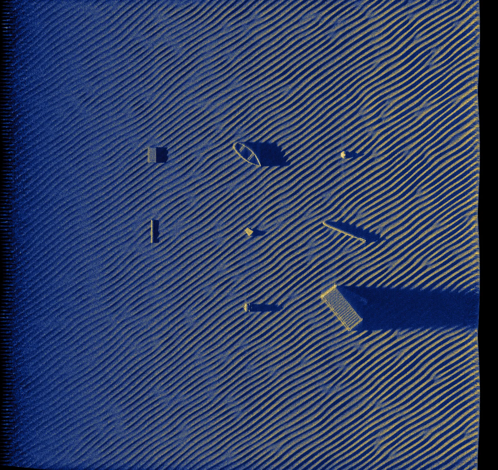 Rippled sandy seafloor with multiple objects and acoustic shadows